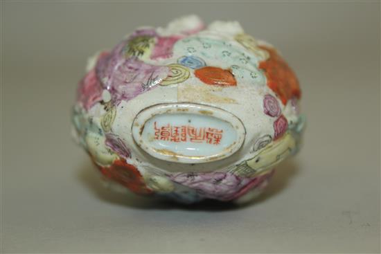 A Chinese moulded famille rose eighteen luohan snuff bottle, Qianlong seal mark, 1820-1850, 7.4cm